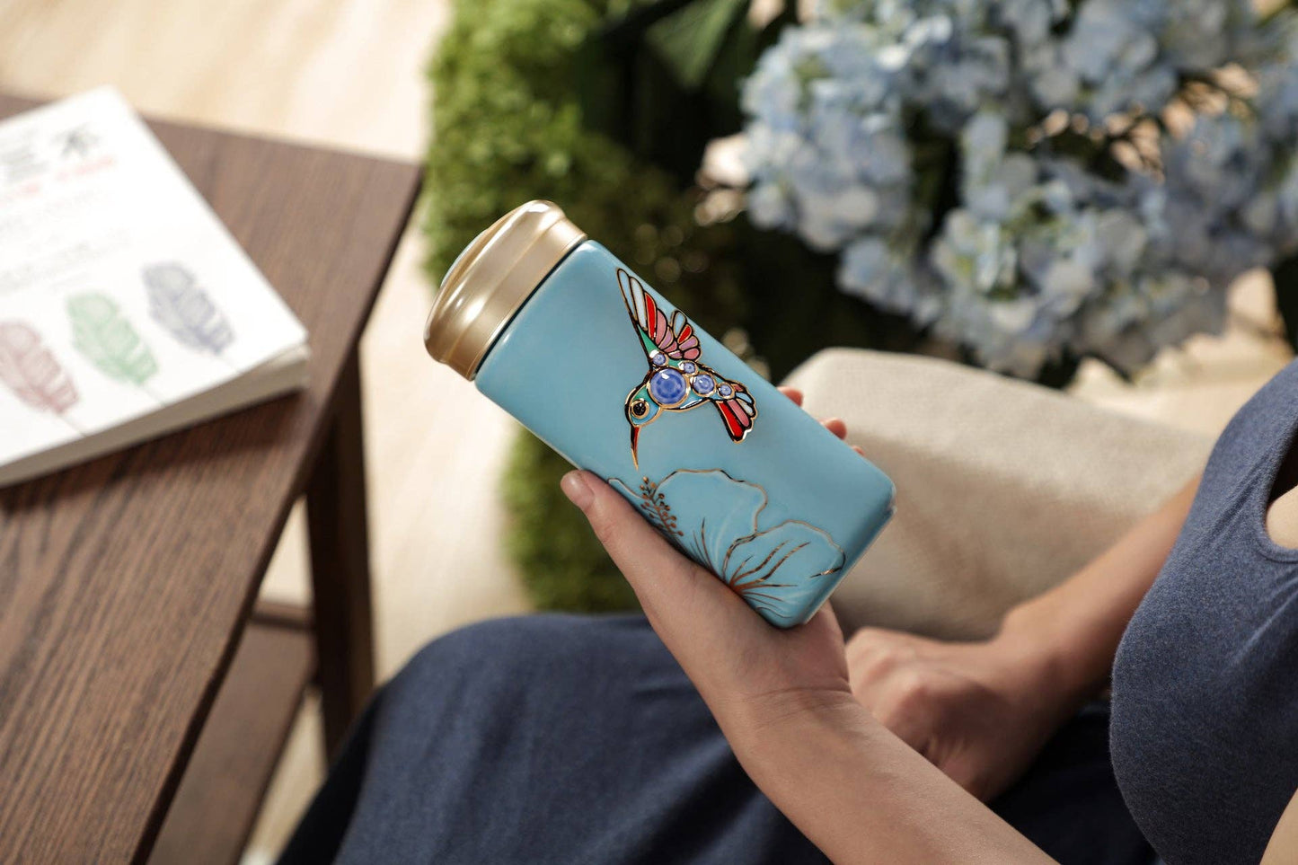 The Hummingbird Travel Mug: Blue and Hand Painted Multi Colored Bird