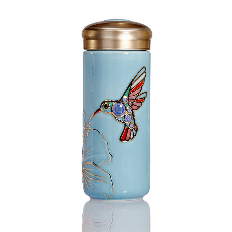 The Hummingbird Travel Mug: Blue and Hand Painted Multi Colored Bird